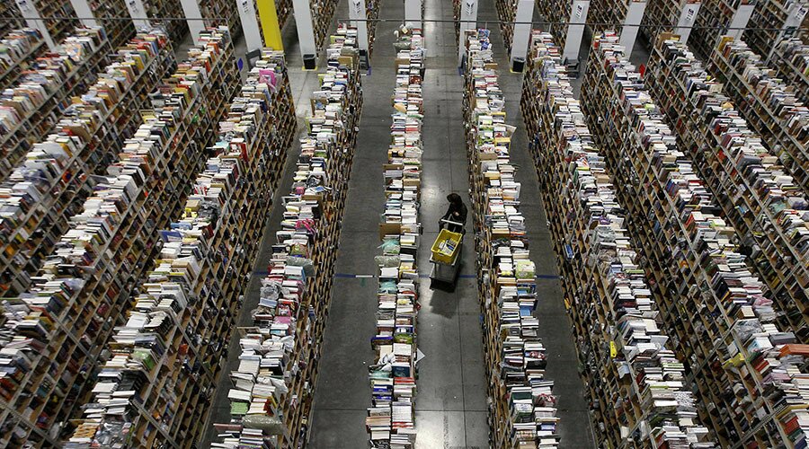 A worker gathers items for delivery from the warehouse floor at Amazon's distribution center in Phoenix, Arizona November 22, 2013. The web-based retailer is preparing for Cyber Monday, which is traditionally the busiest day of the year for online purchases, and falls on December 2 in 2013. REUTERS/Ralph D. Freso (UNITED STATES - Tags: BUSINESS TPX IMAGES OF THE DAY EMPLOYMENT) - RTX15P9T